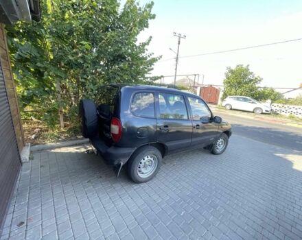 Черный Шевроле Нива, объемом двигателя 1.7 л и пробегом 250 тыс. км за 3800 $, фото 2 на Automoto.ua