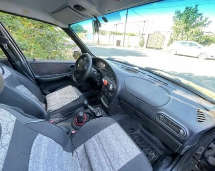 Черный Шевроле Нива, объемом двигателя 1.7 л и пробегом 250 тыс. км за 3800 $, фото 4 на Automoto.ua