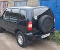 Черный Шевроле Нива, объемом двигателя 1.7 л и пробегом 210 тыс. км за 3300 $, фото 1 на Automoto.ua