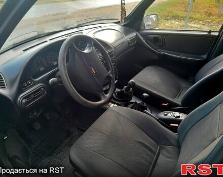 Черный Шевроле Нива, объемом двигателя 1.7 л и пробегом 160 тыс. км за 2999 $, фото 5 на Automoto.ua