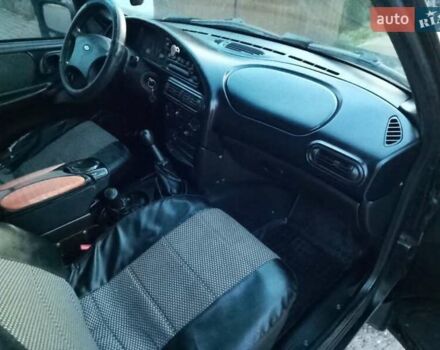 Черный Шевроле Нива, объемом двигателя 1.69 л и пробегом 180 тыс. км за 3300 $, фото 9 на Automoto.ua