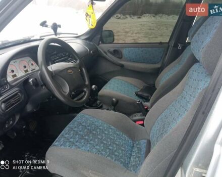 Серый Шевроле Нива, объемом двигателя 1.69 л и пробегом 239 тыс. км за 3650 $, фото 4 на Automoto.ua