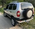 Серый Шевроле Нива, объемом двигателя 1.7 л и пробегом 247 тыс. км за 3500 $, фото 1 на Automoto.ua