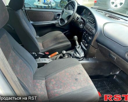 Серый Шевроле Нива, объемом двигателя 1.7 л и пробегом 200 тыс. км за 3350 $, фото 5 на Automoto.ua