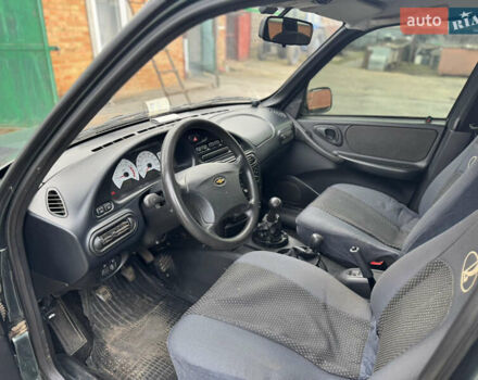 Зелений Шевроле Нива, об'ємом двигуна 1.7 л та пробігом 44 тис. км за 6000 $, фото 9 на Automoto.ua