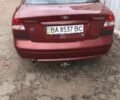Красный Шевроле Нубира, объемом двигателя 2 л и пробегом 200 тыс. км за 3000 $, фото 2 на Automoto.ua