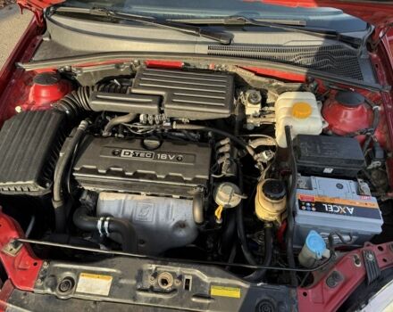 Красный Шевроле Нубира, объемом двигателя 1.8 л и пробегом 231 тыс. км за 3500 $, фото 23 на Automoto.ua