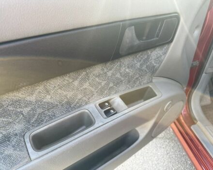 Красный Шевроле Нубира, объемом двигателя 1.8 л и пробегом 231 тыс. км за 3500 $, фото 11 на Automoto.ua