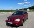Красный Шевроле Нубира, объемом двигателя 1.8 л и пробегом 250 тыс. км за 2900 $, фото 1 на Automoto.ua
