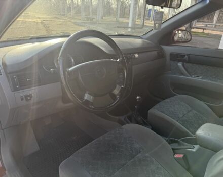 Красный Шевроле Нубира, объемом двигателя 1.8 л и пробегом 231 тыс. км за 3500 $, фото 13 на Automoto.ua