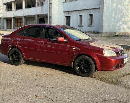 Красный Шевроле Нубира, объемом двигателя 1.8 л и пробегом 231 тыс. км за 3500 $, фото 2 на Automoto.ua