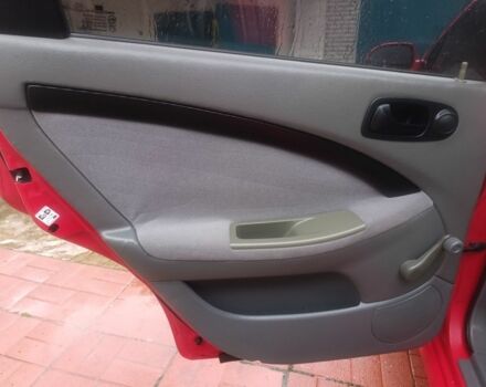 Красный Шевроле Нубира, объемом двигателя 1.6 л и пробегом 235 тыс. км за 3900 $, фото 23 на Automoto.ua