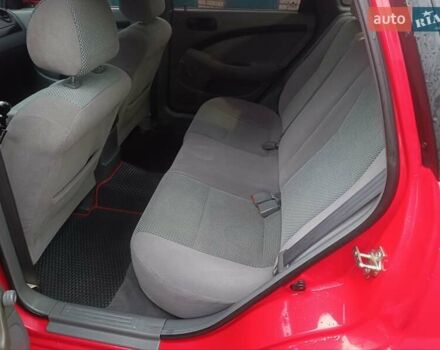 Красный Шевроле Нубира, объемом двигателя 1.6 л и пробегом 235 тыс. км за 3900 $, фото 10 на Automoto.ua