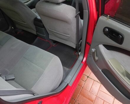 Красный Шевроле Нубира, объемом двигателя 1.6 л и пробегом 235 тыс. км за 3900 $, фото 22 на Automoto.ua