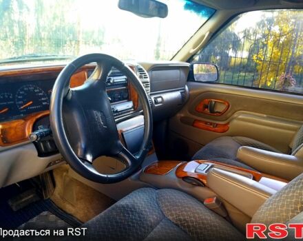 Синій Шевроле Тахо, об'ємом двигуна 5.7 л та пробігом 260 тис. км за 13000 $, фото 4 на Automoto.ua