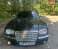 Черный Крайслер 300C, объемом двигателя 5.65 л и пробегом 140 тыс. км за 9999 $, фото 1 на Automoto.ua