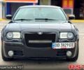 Черный Крайслер 300C, объемом двигателя 57 л и пробегом 300 тыс. км за 8300 $, фото 1 на Automoto.ua