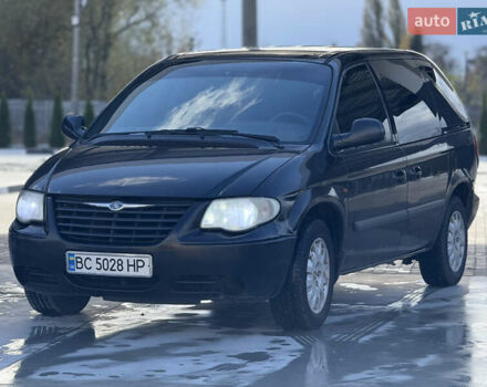 Черный Крайслер Гранд Вояджер, объемом двигателя 2.5 л и пробегом 320 тыс. км за 2999 $, фото 1 на Automoto.ua