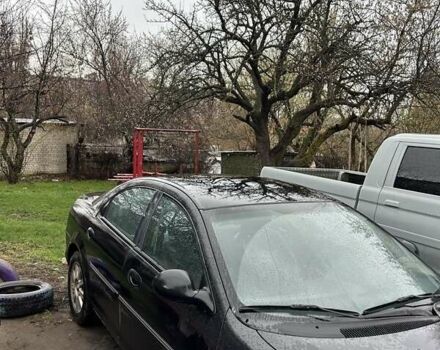 Черный Крайслер Себринг, объемом двигателя 2.7 л и пробегом 196 тыс. км за 5500 $, фото 1 на Automoto.ua