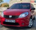 Красный Дачия Сандеро, объемом двигателя 1.39 л и пробегом 240 тыс. км за 3650 $, фото 1 на Automoto.ua