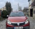 Красный Дачия Сандеро, объемом двигателя 1.6 л и пробегом 145 тыс. км за 5900 $, фото 1 на Automoto.ua
