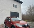 Красный Дачия Сандеро, объемом двигателя 1.6 л и пробегом 172 тыс. км за 6799 $, фото 1 на Automoto.ua