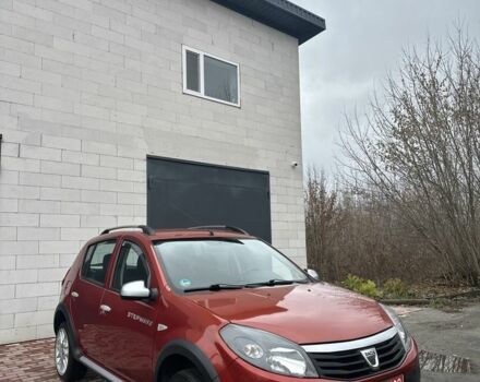 Красный Дачия Сандеро, объемом двигателя 1.6 л и пробегом 172 тыс. км за 6799 $, фото 1 на Automoto.ua