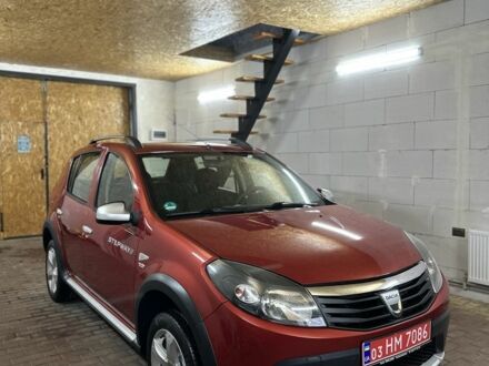 Красный Дачия Сандеро, объемом двигателя 1.6 л и пробегом 157 тыс. км за 6699 $, фото 1 на Automoto.ua
