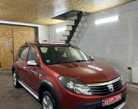 Красный Дачия Сандеро, объемом двигателя 1.6 л и пробегом 157 тыс. км за 6699 $, фото 1 на Automoto.ua
