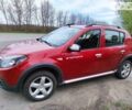 Красный Дачия Sandero StepWay, объемом двигателя 1.6 л и пробегом 143 тыс. км за 6750 $, фото 1 на Automoto.ua