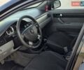 Черный Дэу Джентра, объемом двигателя 1.5 л и пробегом 180 тыс. км за 3999 $, фото 18 на Automoto.ua