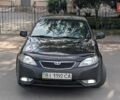 Черный Дэу Джентра, объемом двигателя 1.49 л и пробегом 263 тыс. км за 4500 $, фото 1 на Automoto.ua