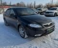 Черный Дэу Джентра, объемом двигателя 1.5 л и пробегом 82 тыс. км за 5499 $, фото 1 на Automoto.ua