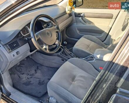 Черный Дэу Джентра, объемом двигателя 1.49 л и пробегом 203 тыс. км за 4700 $, фото 6 на Automoto.ua