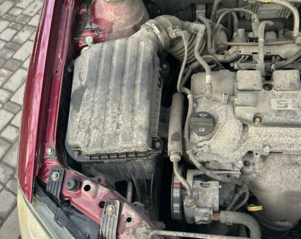 Червоний Деу Джентра, об'ємом двигуна 1.49 л та пробігом 192 тис. км за 6700 $, фото 3 на Automoto.ua