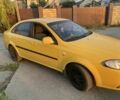 Желтый Дэу Джентра, объемом двигателя 1.5 л и пробегом 320 тыс. км за 2900 $, фото 1 на Automoto.ua