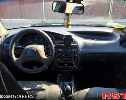 Белый Дэу Ланос, объемом двигателя 1.5 л и пробегом 301 тыс. км за 1750 $, фото 6 на Automoto.ua