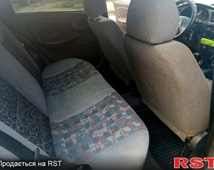 Белый Дэу Ланос, объемом двигателя 1.5 л и пробегом 257 тыс. км за 1750 $, фото 4 на Automoto.ua