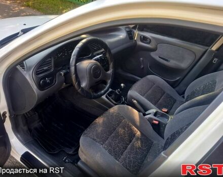 Белый Дэу Ланос, объемом двигателя 1.5 л и пробегом 225 тыс. км за 2000 $, фото 1 на Automoto.ua