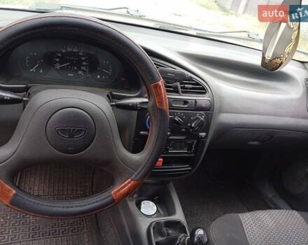 Білий Деу Ланос, об'ємом двигуна 1.39 л та пробігом 150 тис. км за 2000 $, фото 1 на Automoto.ua