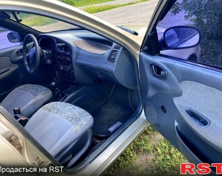 Бежевий Деу Ланос, об'ємом двигуна 1.5 л та пробігом 385 тис. км за 2300 $, фото 4 на Automoto.ua