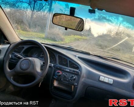 Бежевый Дэу Ланос, объемом двигателя 1.5 л и пробегом 208 тыс. км за 1300 $, фото 5 на Automoto.ua