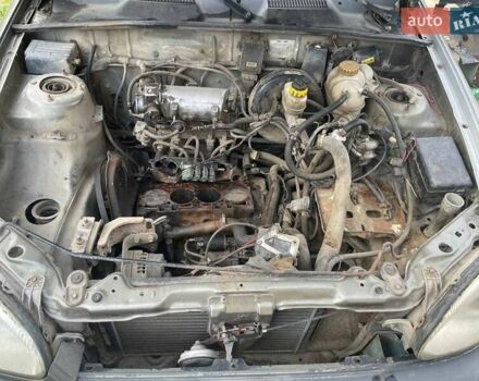 Бежевый Дэу Ланос, объемом двигателя 1.39 л и пробегом 226 тыс. км за 800 $, фото 7 на Automoto.ua