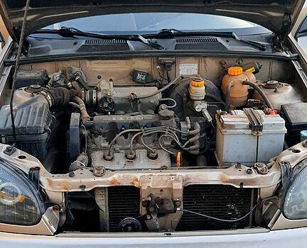 Бежевый Дэу Ланос, объемом двигателя 1.5 л и пробегом 170 тыс. км за 2200 $, фото 3 на Automoto.ua