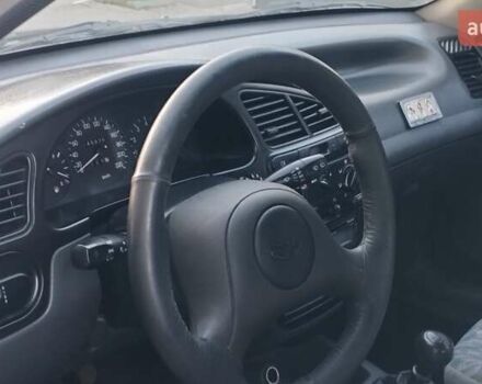 Черный Дэу Ланос, объемом двигателя 1.5 л и пробегом 145 тыс. км за 1950 $, фото 14 на Automoto.ua