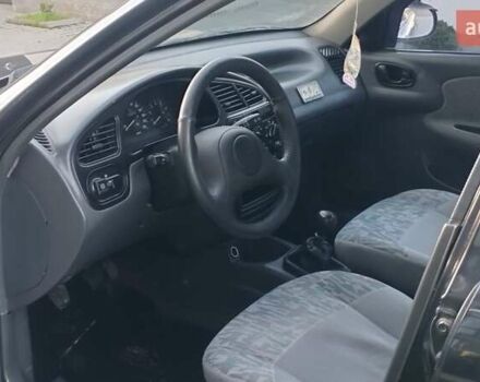 Черный Дэу Ланос, объемом двигателя 1.5 л и пробегом 145 тыс. км за 1950 $, фото 16 на Automoto.ua