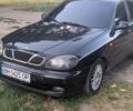 Чорний Деу Ланос, об'ємом двигуна 1.6 л та пробігом 205 тис. км за 1500 $, фото 1 на Automoto.ua