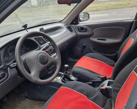 Черный Дэу Ланос, объемом двигателя 1.5 л и пробегом 42 тыс. км за 3000 $, фото 3 на Automoto.ua