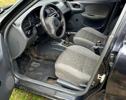 Черный Дэу Ланос, объемом двигателя 1.5 л и пробегом 250 тыс. км за 1400 $, фото 4 на Automoto.ua