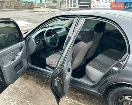 Черный Дэу Ланос, объемом двигателя 1.5 л и пробегом 230 тыс. км за 1650 $, фото 6 на Automoto.ua